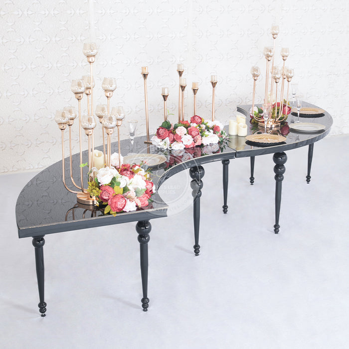 serpentine black dining table