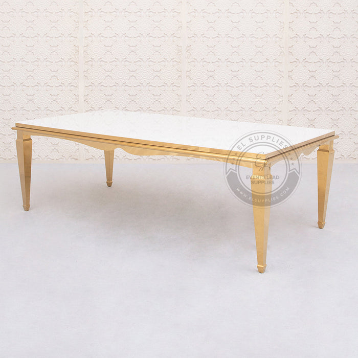 gold 8 by 4-foot table with a white glass top