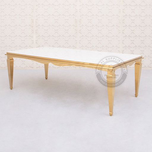 gold 8 by 4-foot table with a white glass top 
